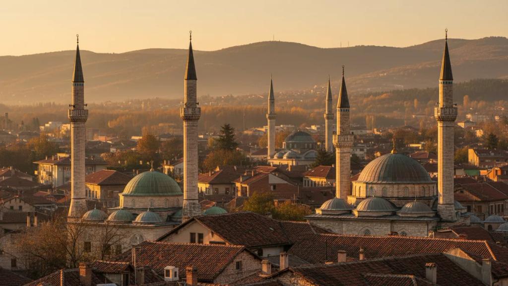 Old town rooftops and Ottoman minarets at golden hour in Kosovo