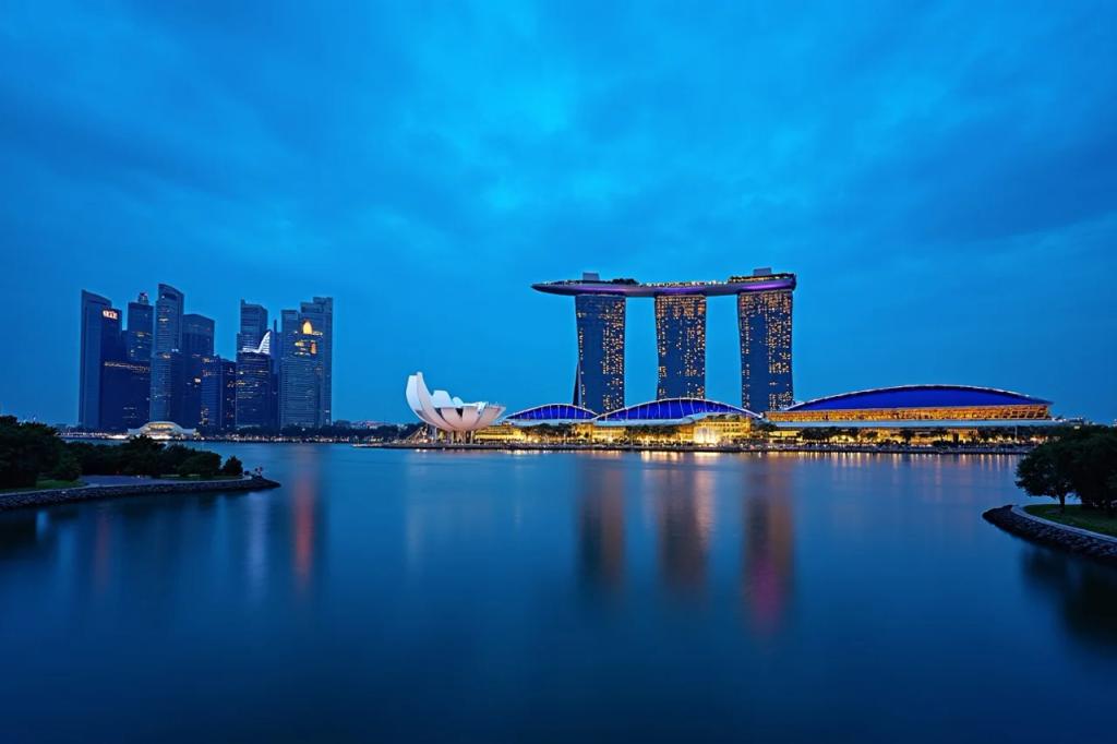 Marina Bay Sands hotel and Singapore skyline reflected in the bay at dusk
