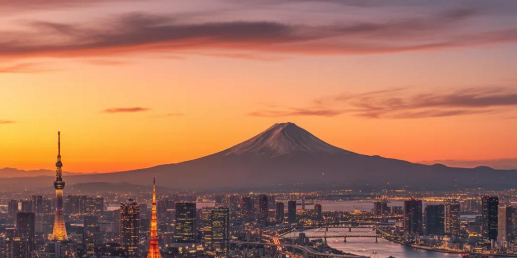 Tokyo skyline at dusk with Mount Fuji rising on the horizon
