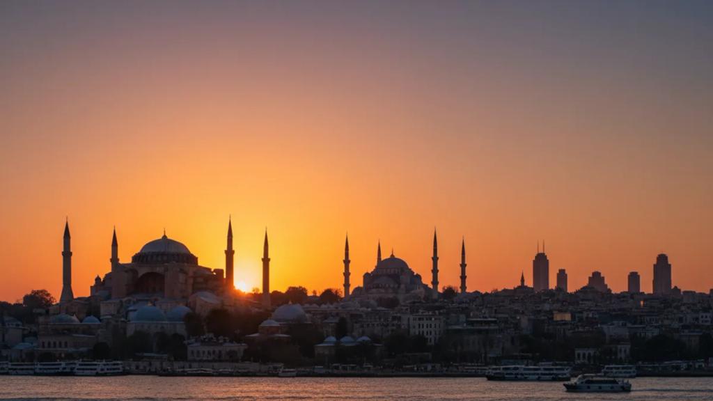 UK traveler by the Bosphorus in Istanbul at golden hour checking a phone with a connected signal